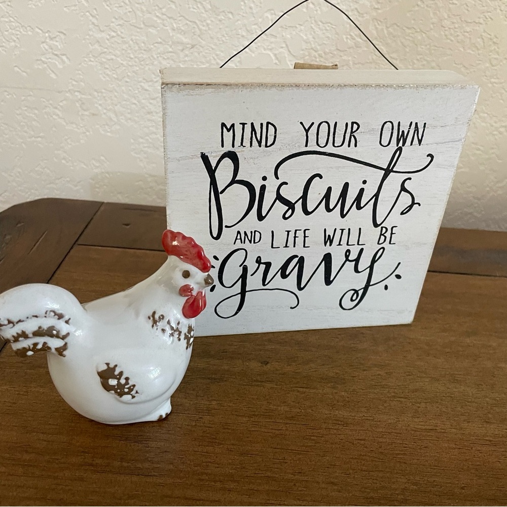 Funny sign with terra cotta chicken with porcelain glaze